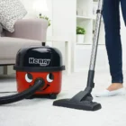 Numatic Henry vacuum cleaning a carpet