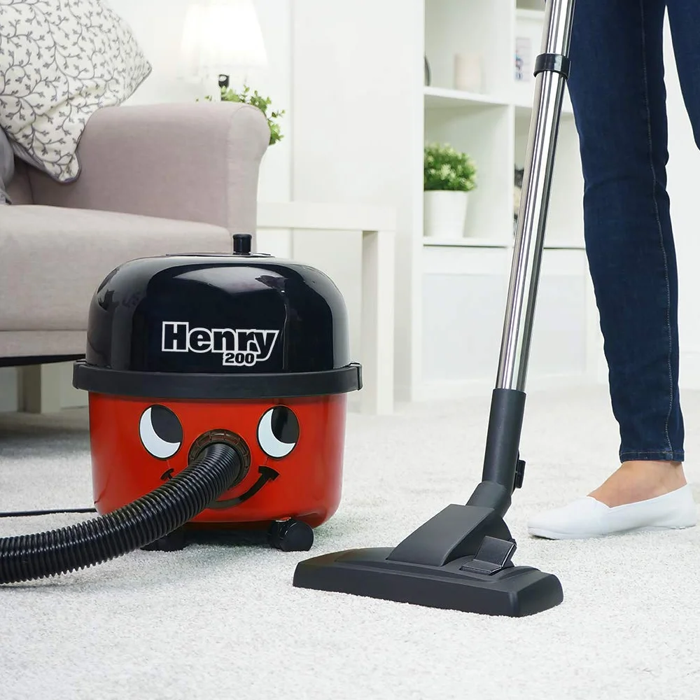 Numatic Henry vacuum cleaning a carpet